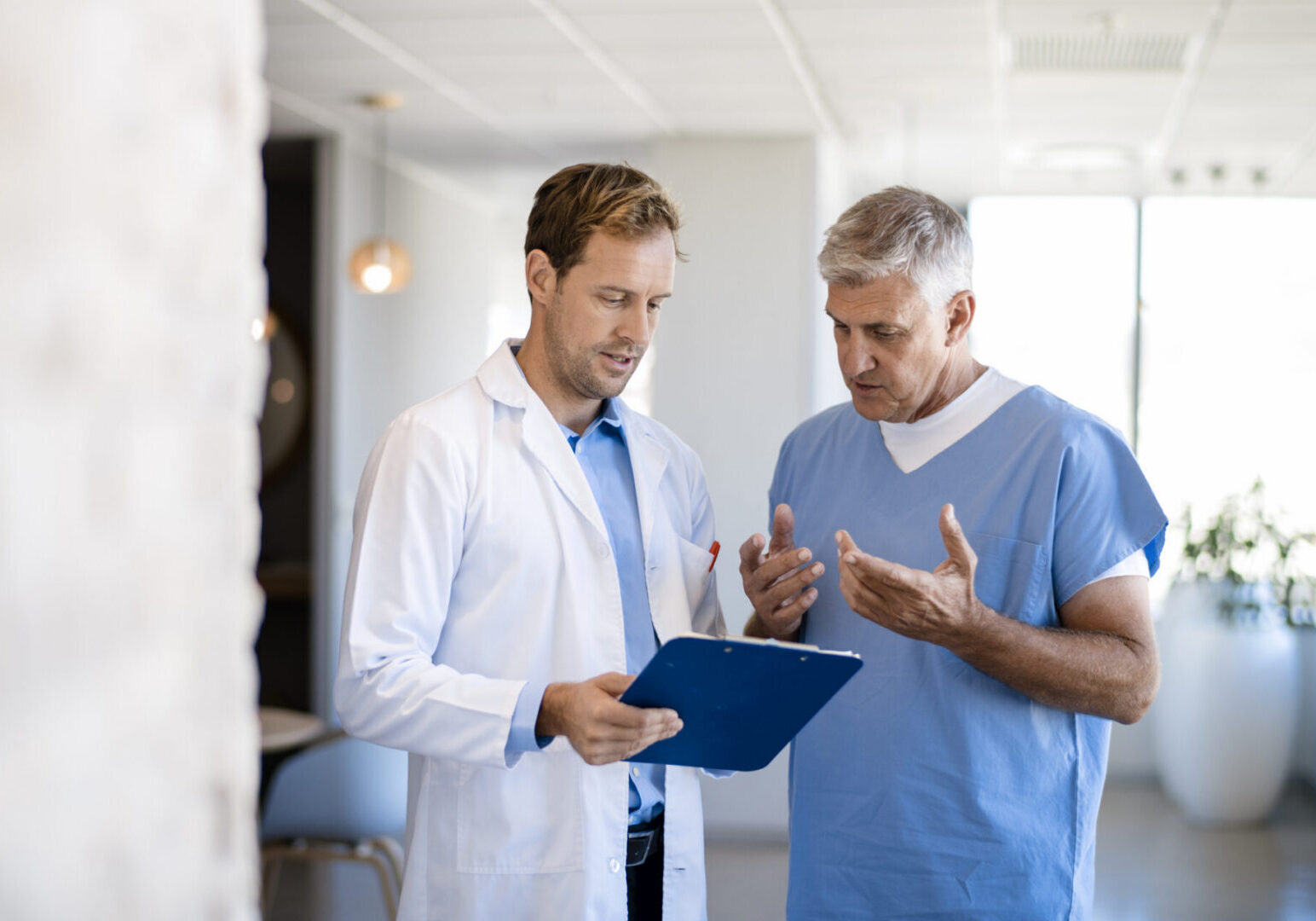 Doctor discussing medical records with patient